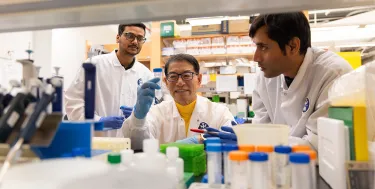 Subhashin Ghosh, Dr. Jake Jinkun Chen, and Siddhartha Das in Chen's lab testing.