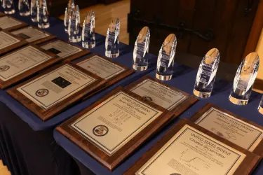 a table full of awards for patents earned by Tufts faculty members