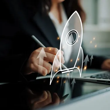 woman working on a laptop with an illustration of a rocket superimposed on top
