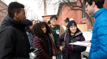 Tufts volunteer as they wait to enter a campaign event
