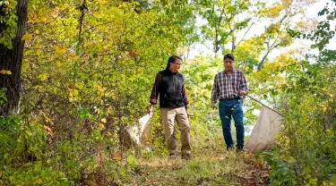  Linden Hu and Sam R. Telford III in a field