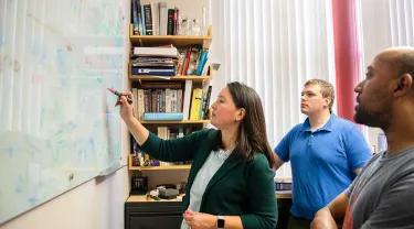Tufts School of Medicine faculty member Bree Aldridge at work with colleagues