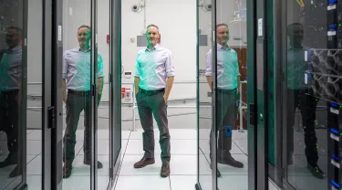 Portrait of Josh Bongard in the computer server room
