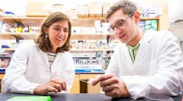 Wellner Professor of Immunology Pilar Alcaide and MD/PhD candidate Abe Bayer at work in the lab