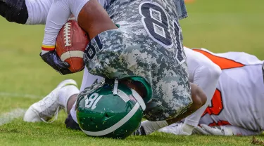 High school football player in for the touchdown.