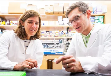 Wellner Professor of Immunology Pilar Alcaide and MD/PhD candidate Abe Bayer at work in the lab