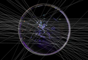 Many thin white lines crossing over a circle against a black background, with small dots of blue and red colors within the circle
