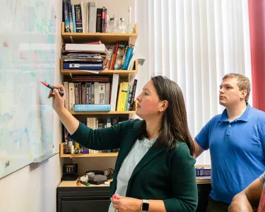Tufts School of Medicine faculty member Bree Aldridge at work with colleagues