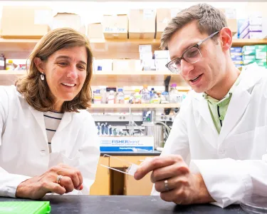 Wellner Professor of Immunology Pilar Alcaide and MD/PhD candidate Abe Bayer at work in the lab
