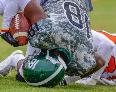 High school football player in for the touchdown.